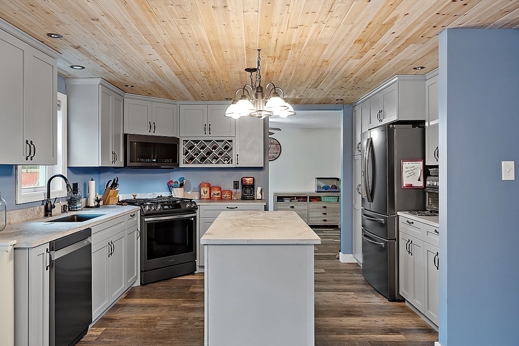 511 S Road Templeton, MA 01468 - Photo 4 of 33 a kitchen with kitchen island a sink stainless steel appliances and cabinets