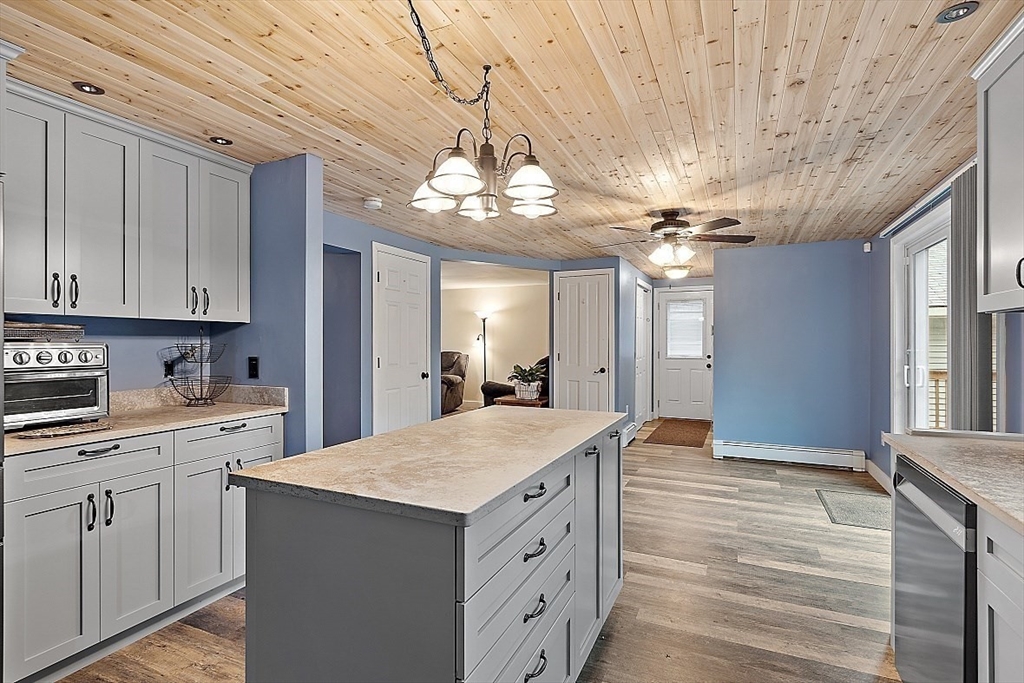 511 S Road Templeton, MA 01468 - Photo 5 of 33 a kitchen with kitchen island granite countertop a sink cabinets and wooden floor
