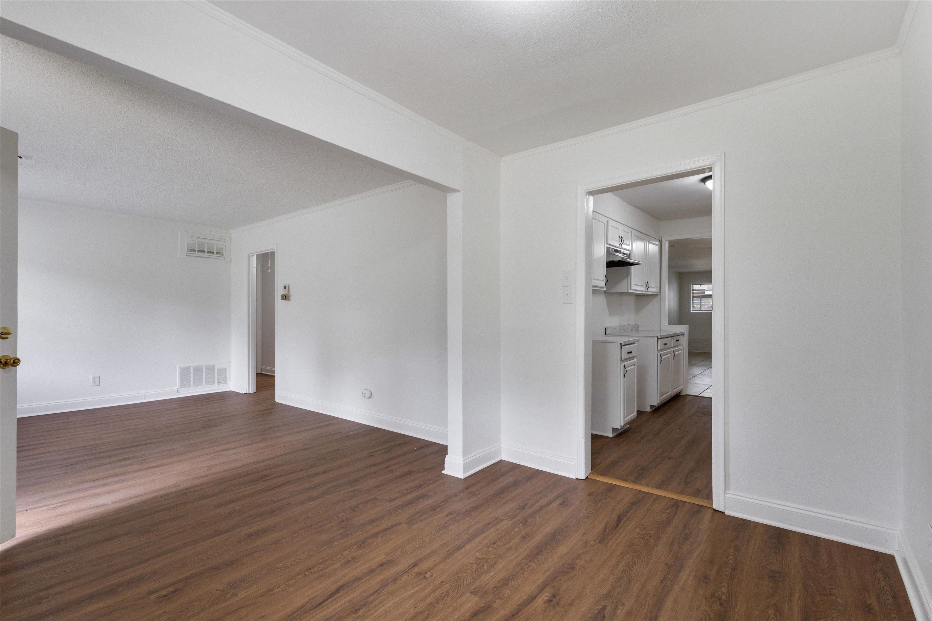 4565 Verne Road Memphis, TN 38117 - Photo 5 of 18 Spacious interior featuring wood-finish flooring, white walls, and bright white trim