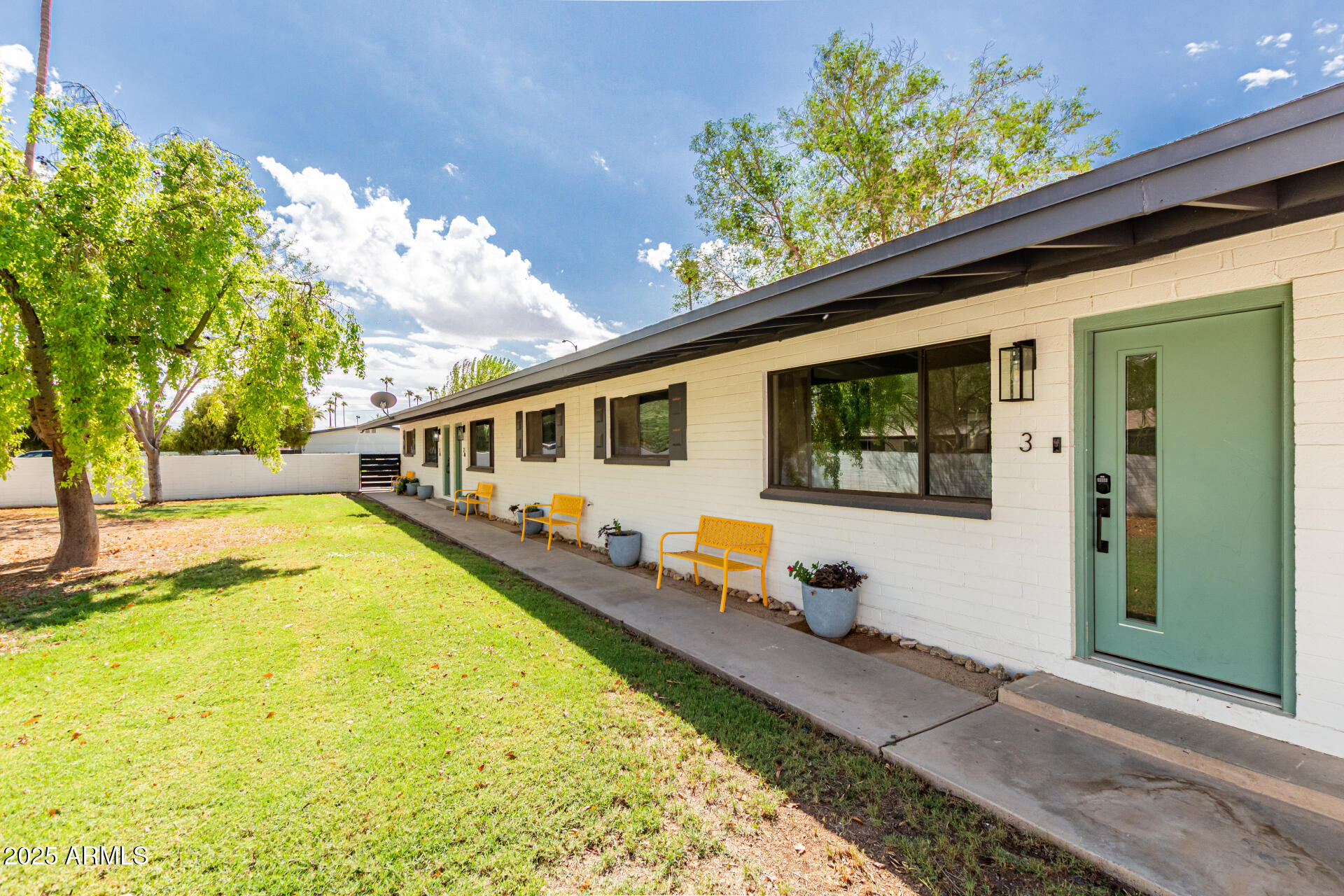 a front view of a house with a yard