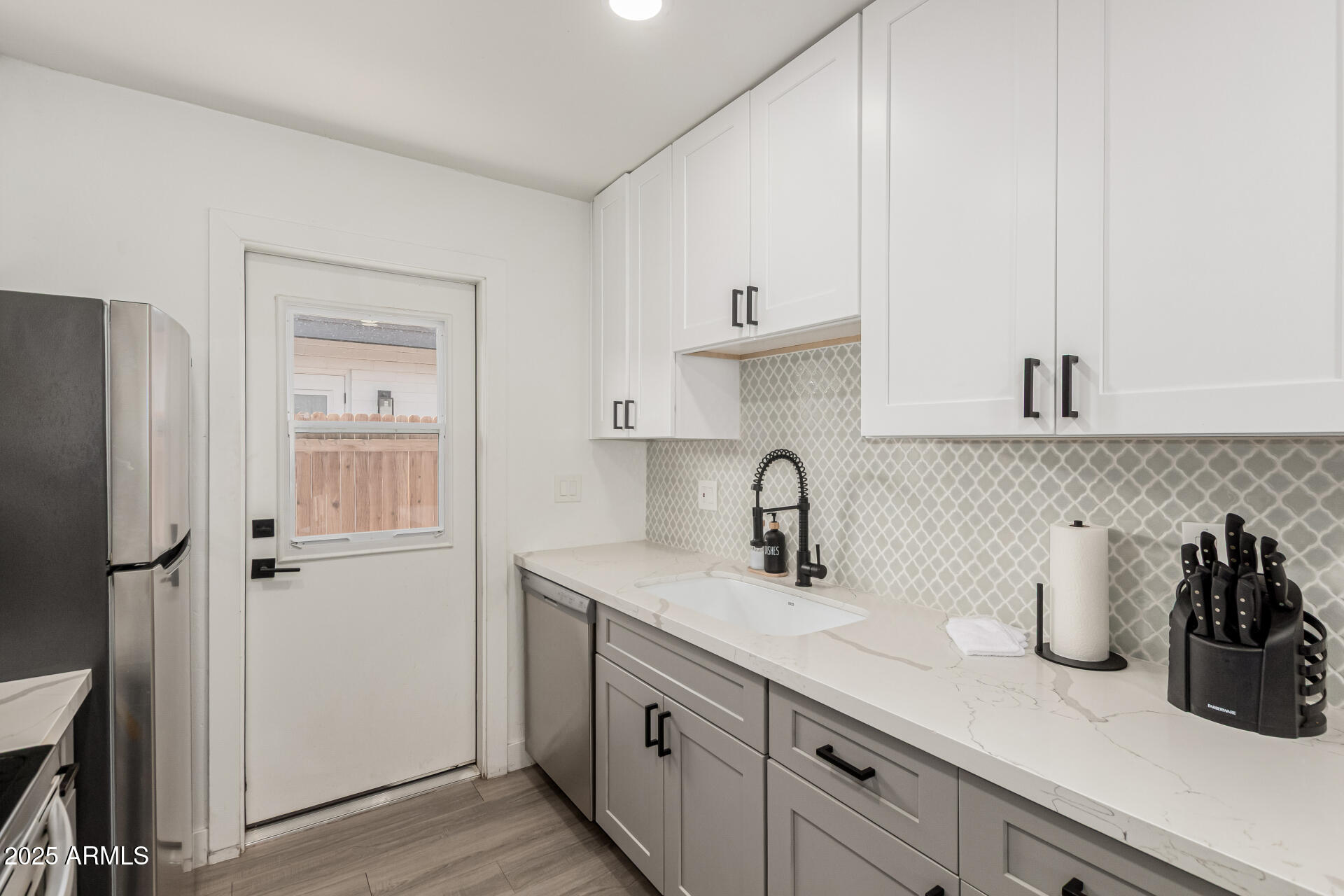 6628 East Avalon Drive, Unit 1 Scottsdale, AZ 85251 - Photo 14 of 29 a kitchen with sink cabinets and window
