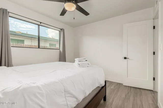 a bedroom with a bed and window