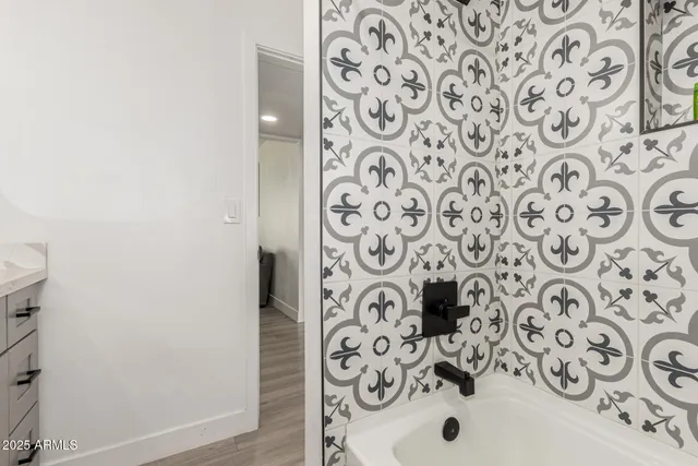 a bathroom with a shower and a curtain