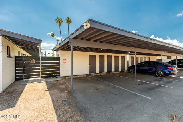 a view of garage with parked cars