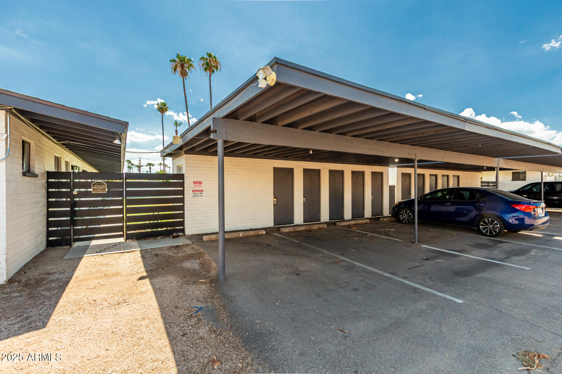 6628 East Avalon Drive, Unit 1 Scottsdale, AZ 85251 - Photo 26 of 29 a view of garage with parked cars
