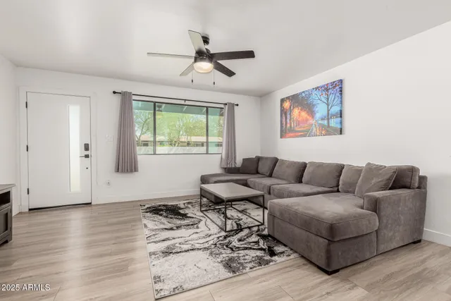 a living room with furniture and a window