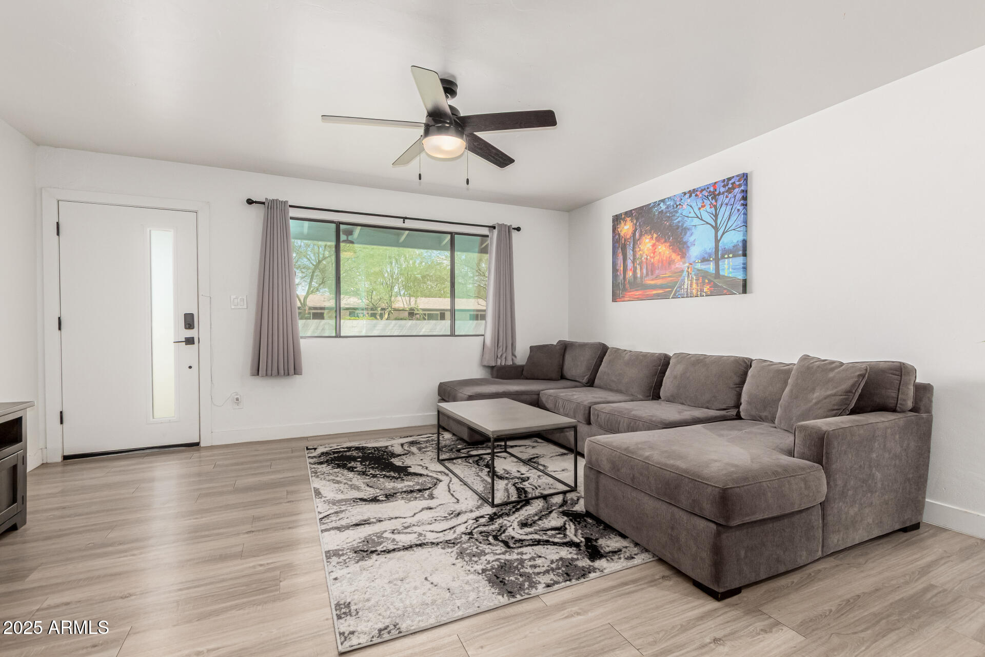 6628 East Avalon Drive, Unit 1 Scottsdale, AZ 85251 - Photo 4 of 29 a living room with furniture and a window