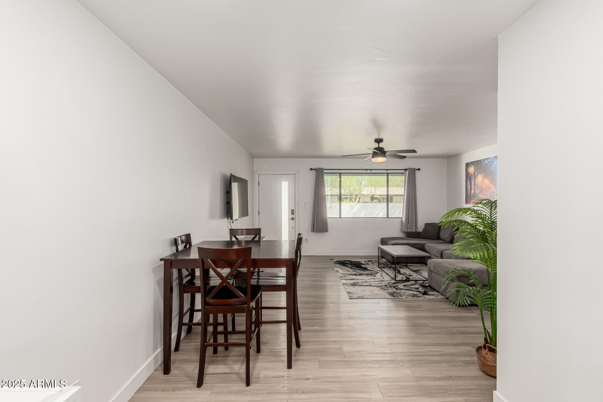 6628 East Avalon Drive, Unit 1 Scottsdale, AZ 85251 - Photo 8 of 29 a view of a dining room with furniture and chandelier