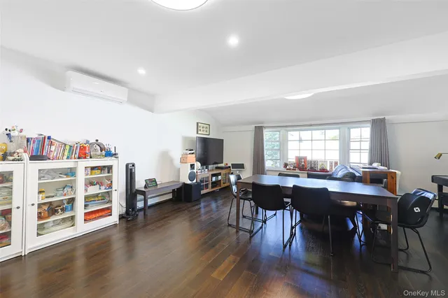 a view of a livingroom with furniture window and wooden floor