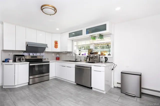 a kitchen with a stove and a refrigerator