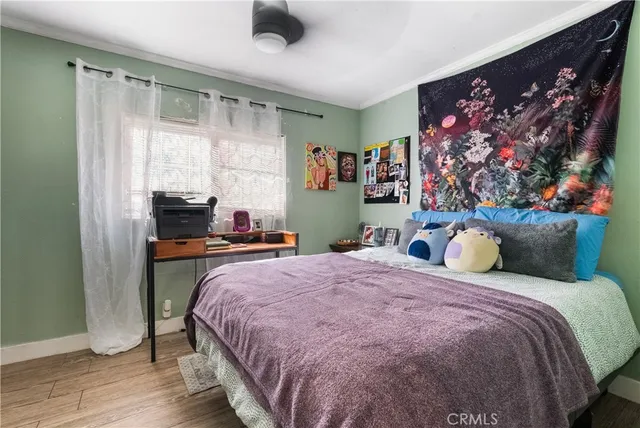 a bedroom with bed and a window