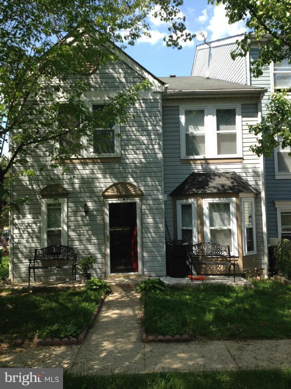 1720 Wilcox Lane Silver Spring, MD 20906 - Photo 1 of 27 a front view of a house with a garden