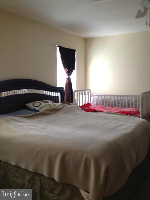 1720 Wilcox Lane Silver Spring, MD 20906 - Photo 13 of 27 a bedroom with a bed and window