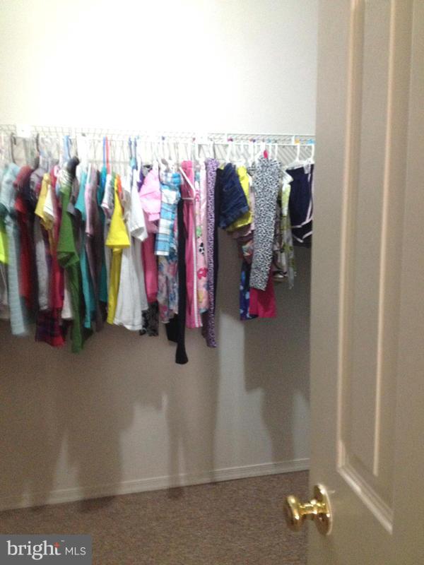 1720 Wilcox Lane Silver Spring, MD 20906 - Photo 16 of 27 a view of walk in closet with clothes