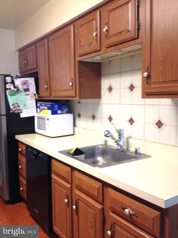 1720 Wilcox Lane Silver Spring, MD 20906 - Photo 10 of 27 a kitchen with granite countertop cabinets and sink