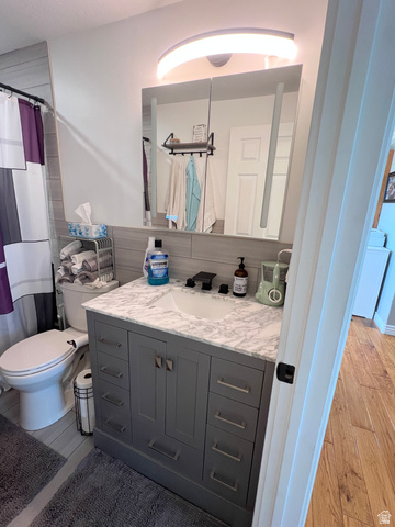 1852 East 3500th Street South Vernal, UT 84078 - Photo 21 of 46 Bathroom with vanity, light wood-type flooring, a shower with curtain
