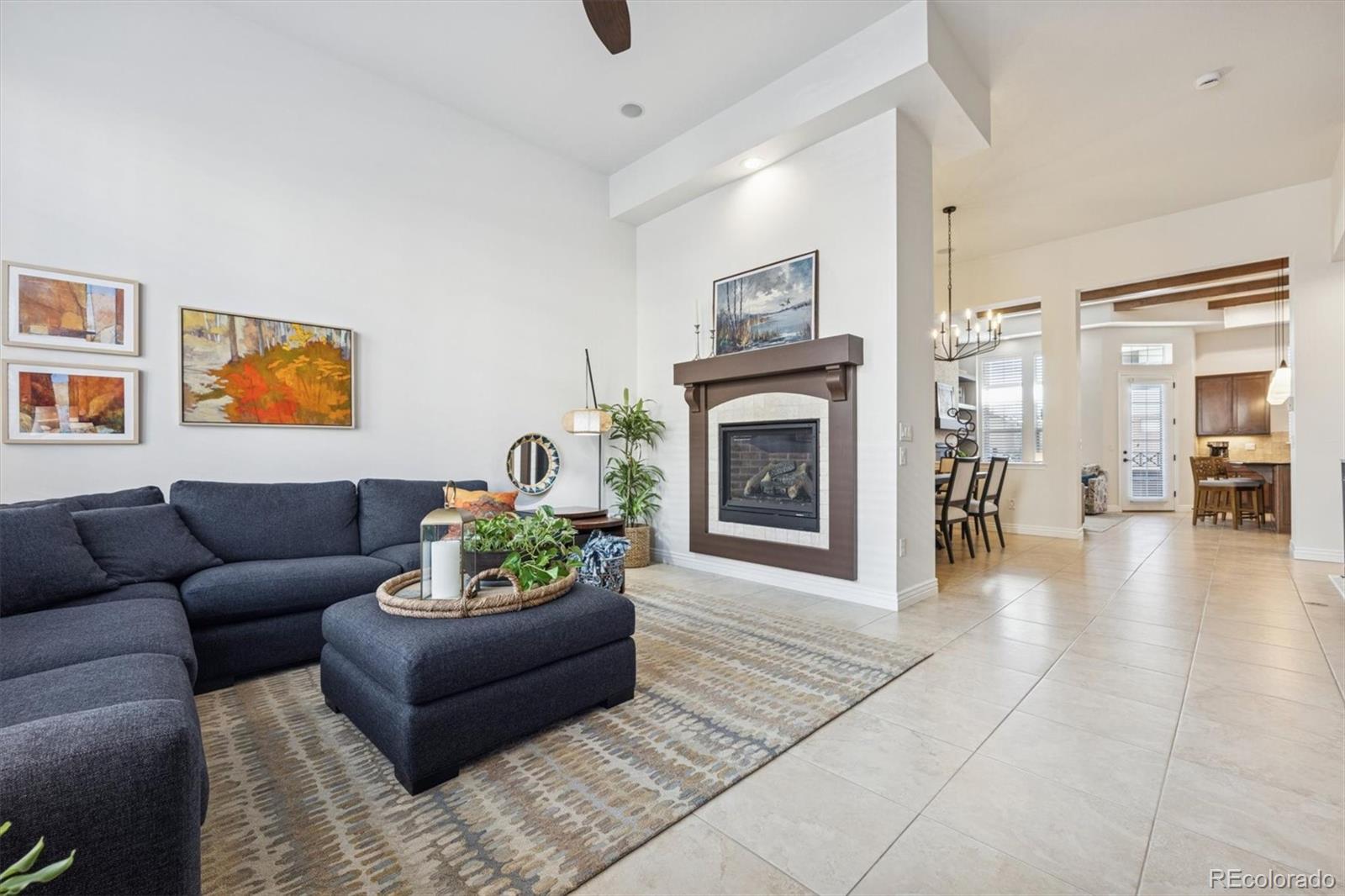 10130 Inverness Main Street Englewood, CO 80112 - Photo 1 of 44 a living room with furniture and a fireplace