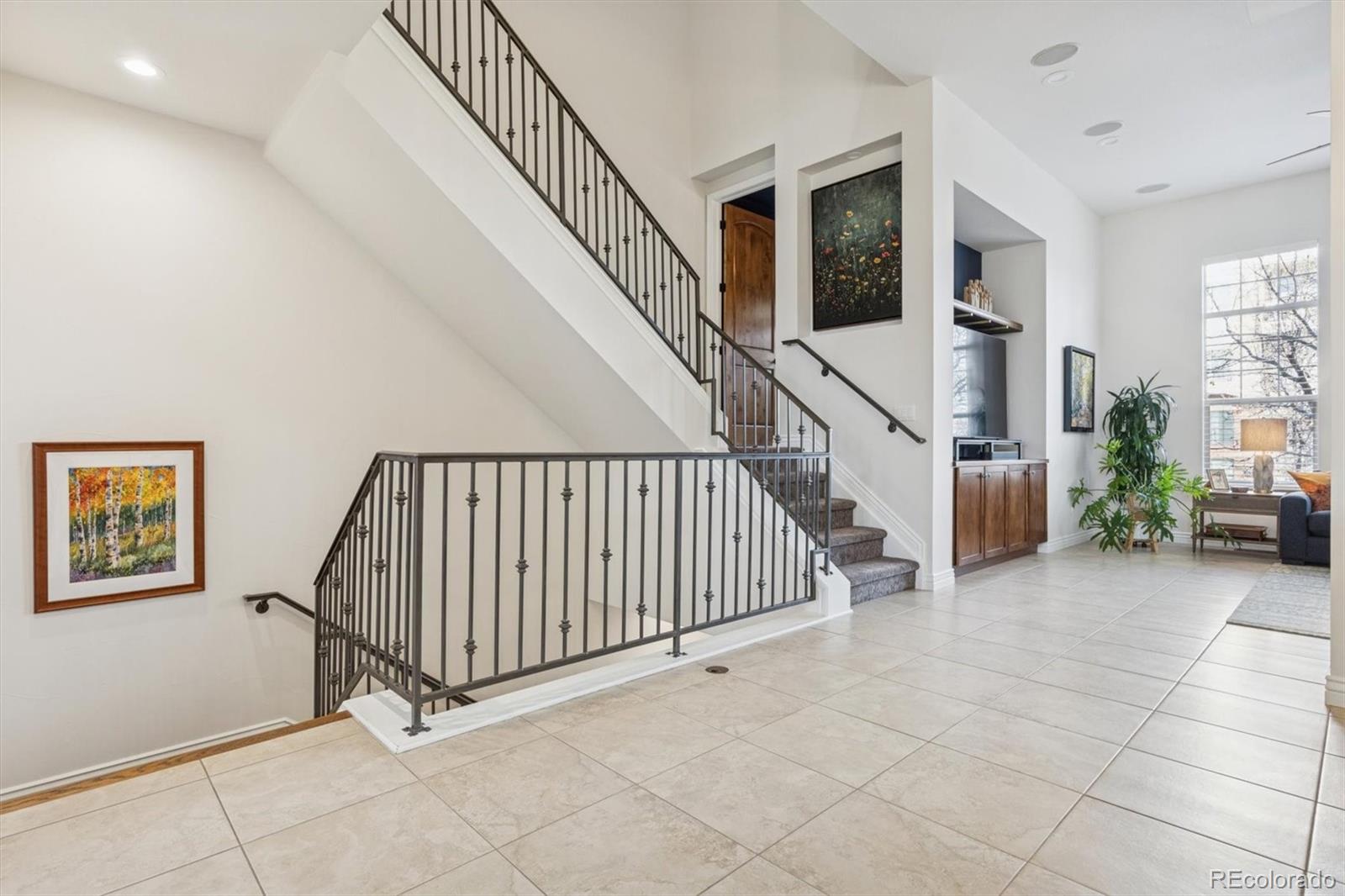 10130 Inverness Main Street Englewood, CO 80112 - Photo 16 of 44 a view of staircase with white walls and a window