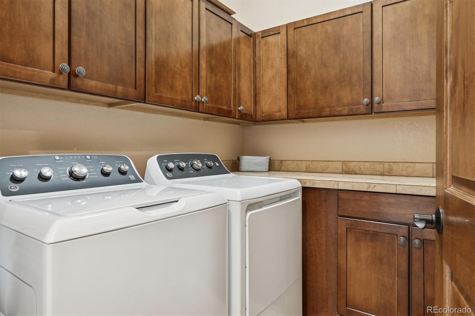 10130 Inverness Main Street Englewood, CO 80112 - Photo 28 of 44 a utility room with dryer and washer