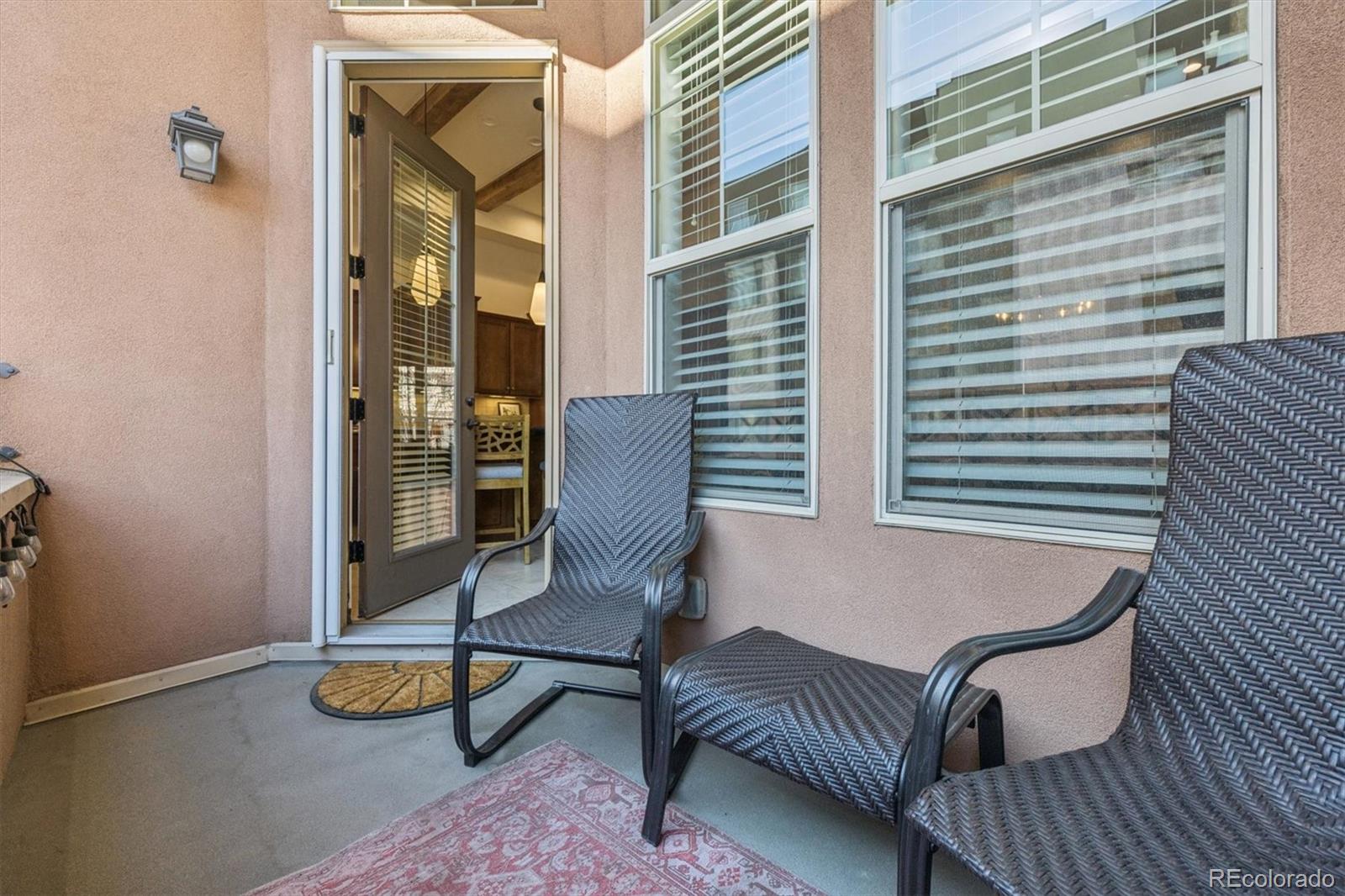 10130 Inverness Main Street Englewood, CO 80112 - Photo 35 of 44 a view of a patio with a table and chairs