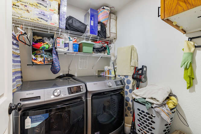 213 Chandler Crossing Trail Round Rock, TX 78665 - Photo 25 of 34 Laundry area with washing machine and clothes dryer