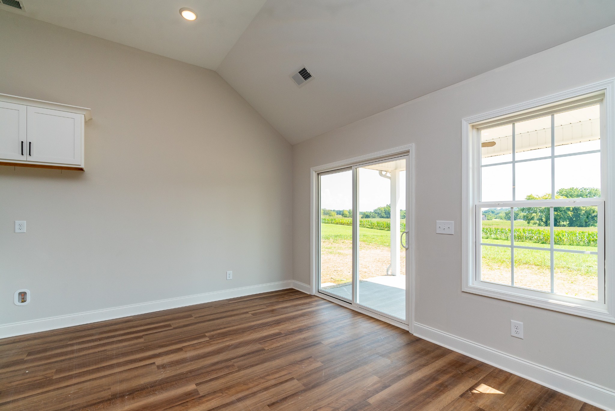 4144 Dot Road Springfield, TN 37172 - Photo 20 of 52 a view of an empty room with wooden floor and a window