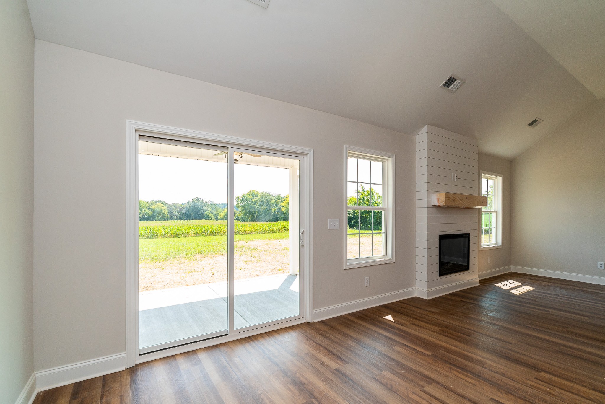 4144 Dot Road Springfield, TN 37172 - Photo 23 of 52 a view of an empty room with a window and wooden floor