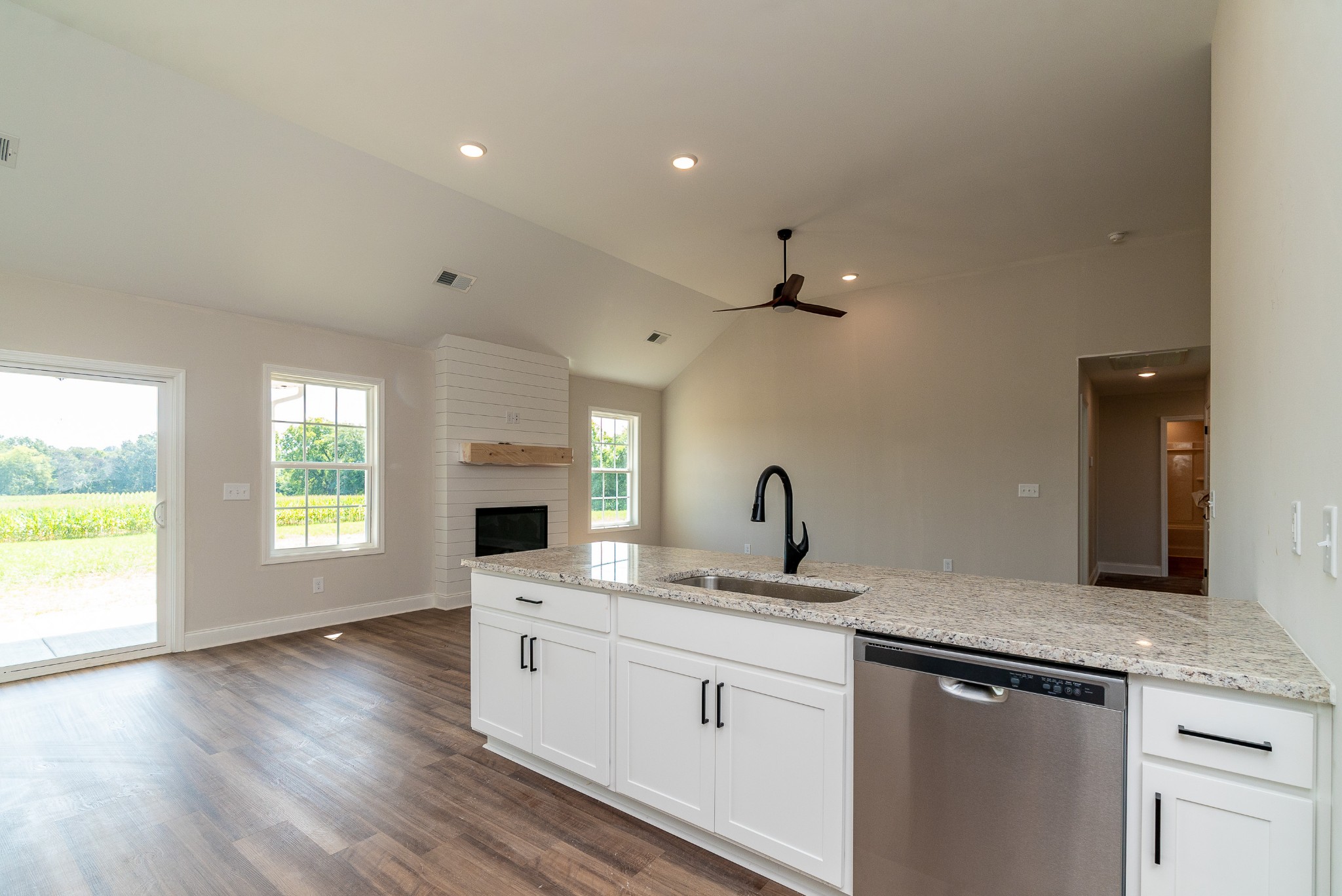 4144 Dot Road Springfield, TN 37172 - Photo 26 of 52 a kitchen with granite countertop a sink cabinets appliances and a window