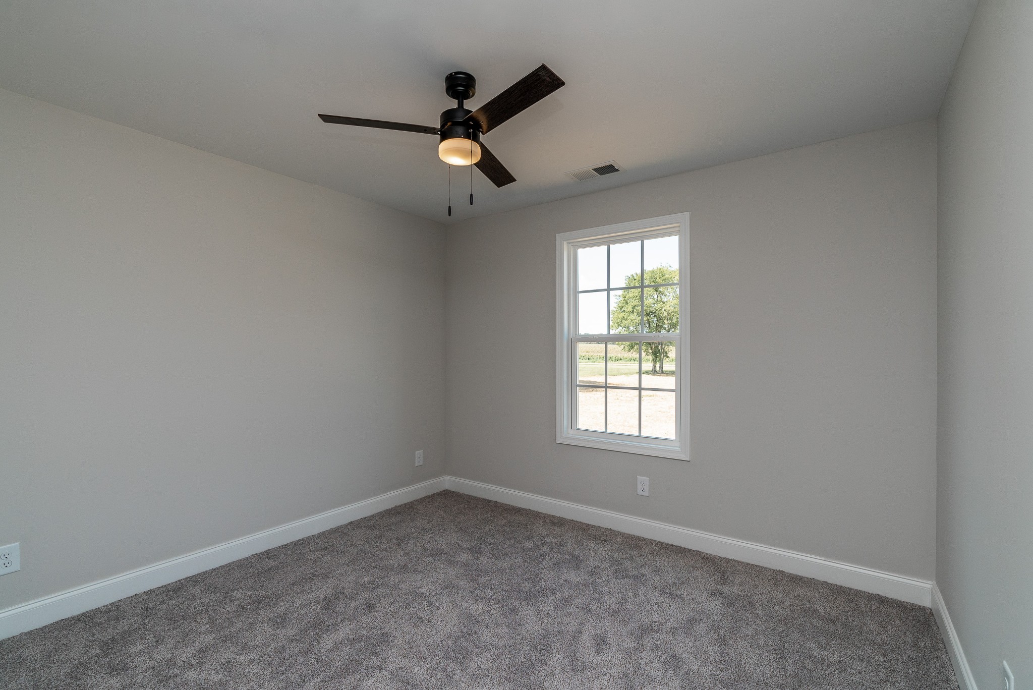 4144 Dot Road Springfield, TN 37172 - Photo 41 of 52 an empty room with a window and ceiling fan
