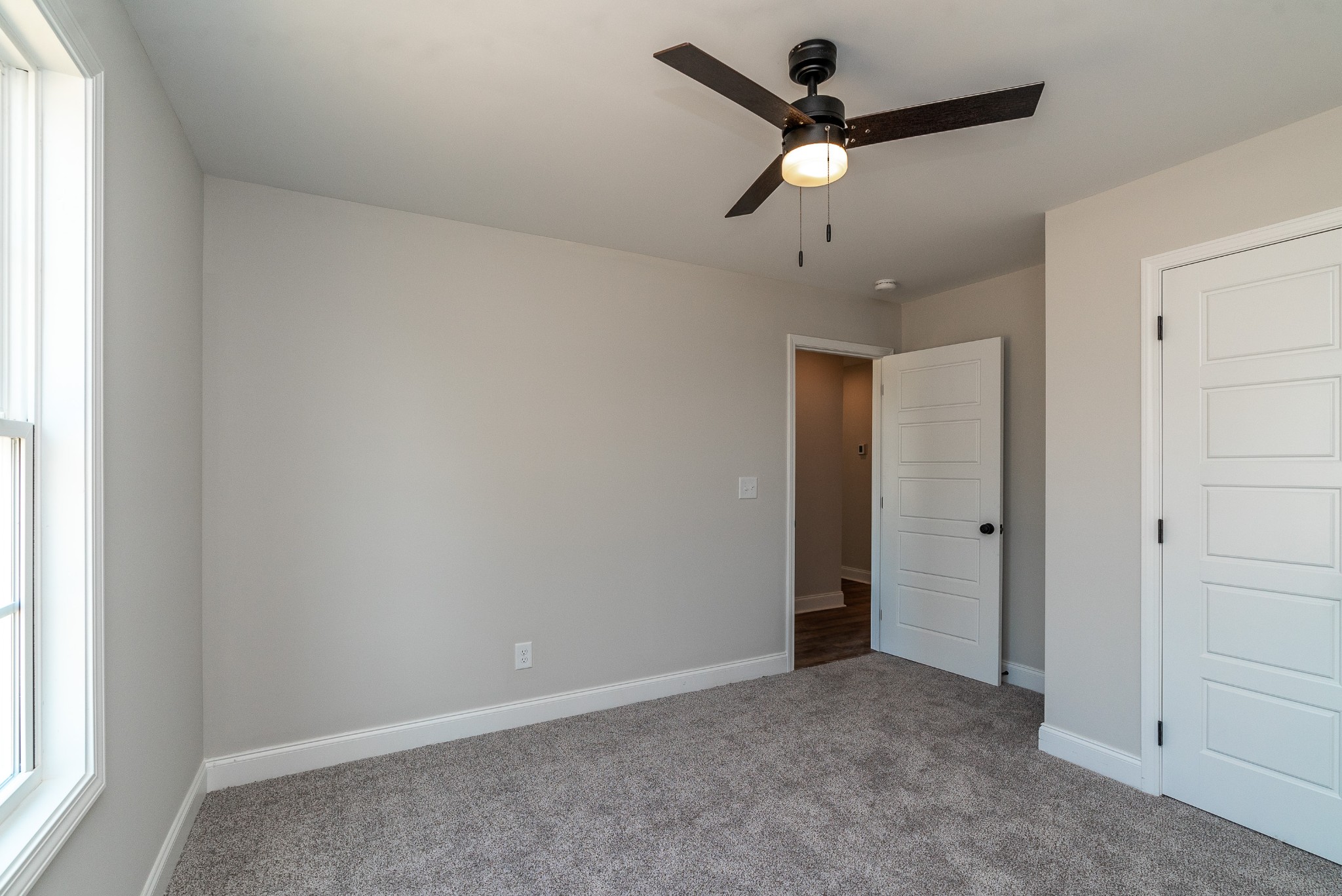4144 Dot Road Springfield, TN 37172 - Photo 43 of 52 an empty room with a ceiling fan and a window