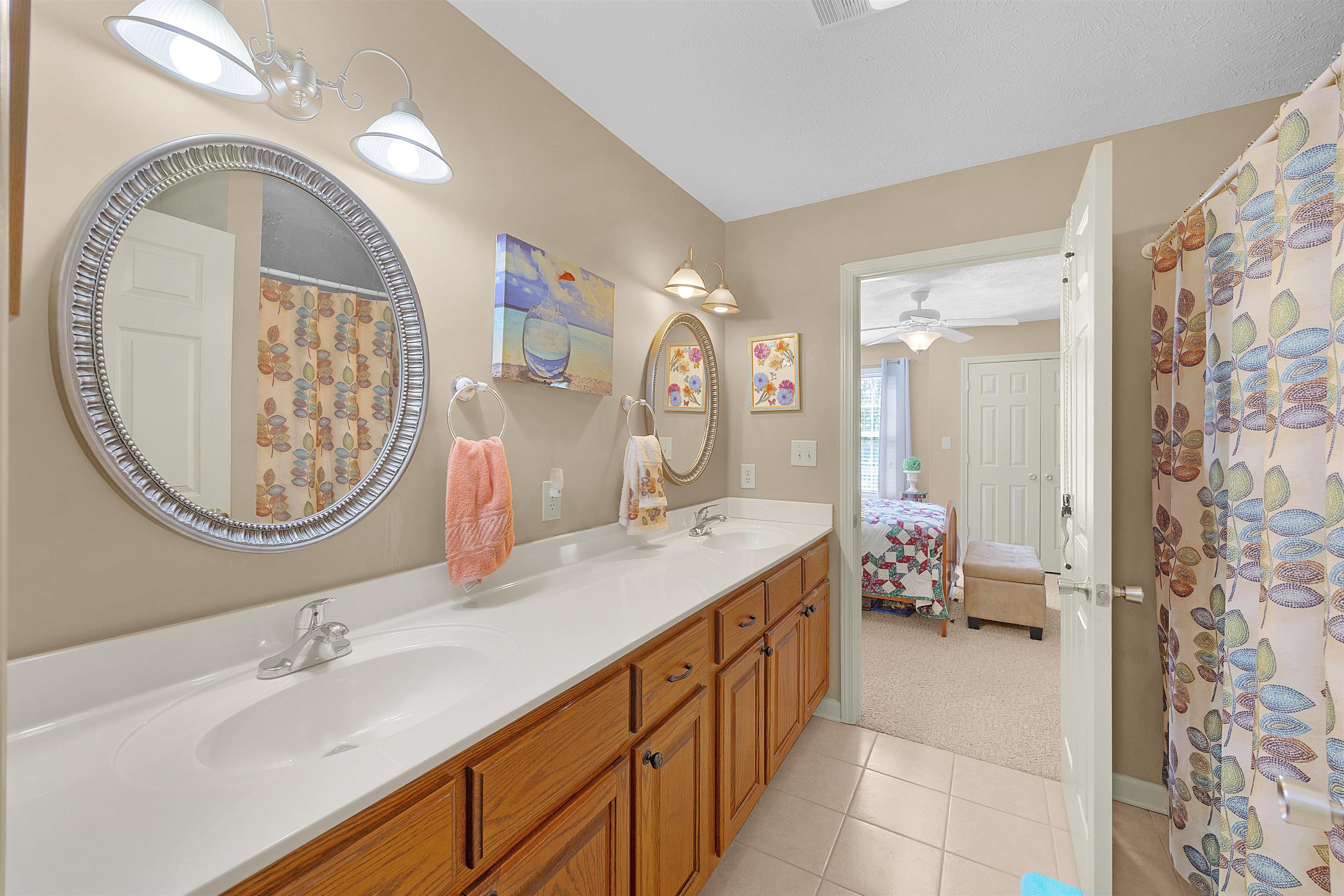 165 Ping Hl Cove Counce, TN 38326 - Photo 13 of 19 Bathroom featuring double vanity, ceiling fan, a sink, and tile patterned flooring