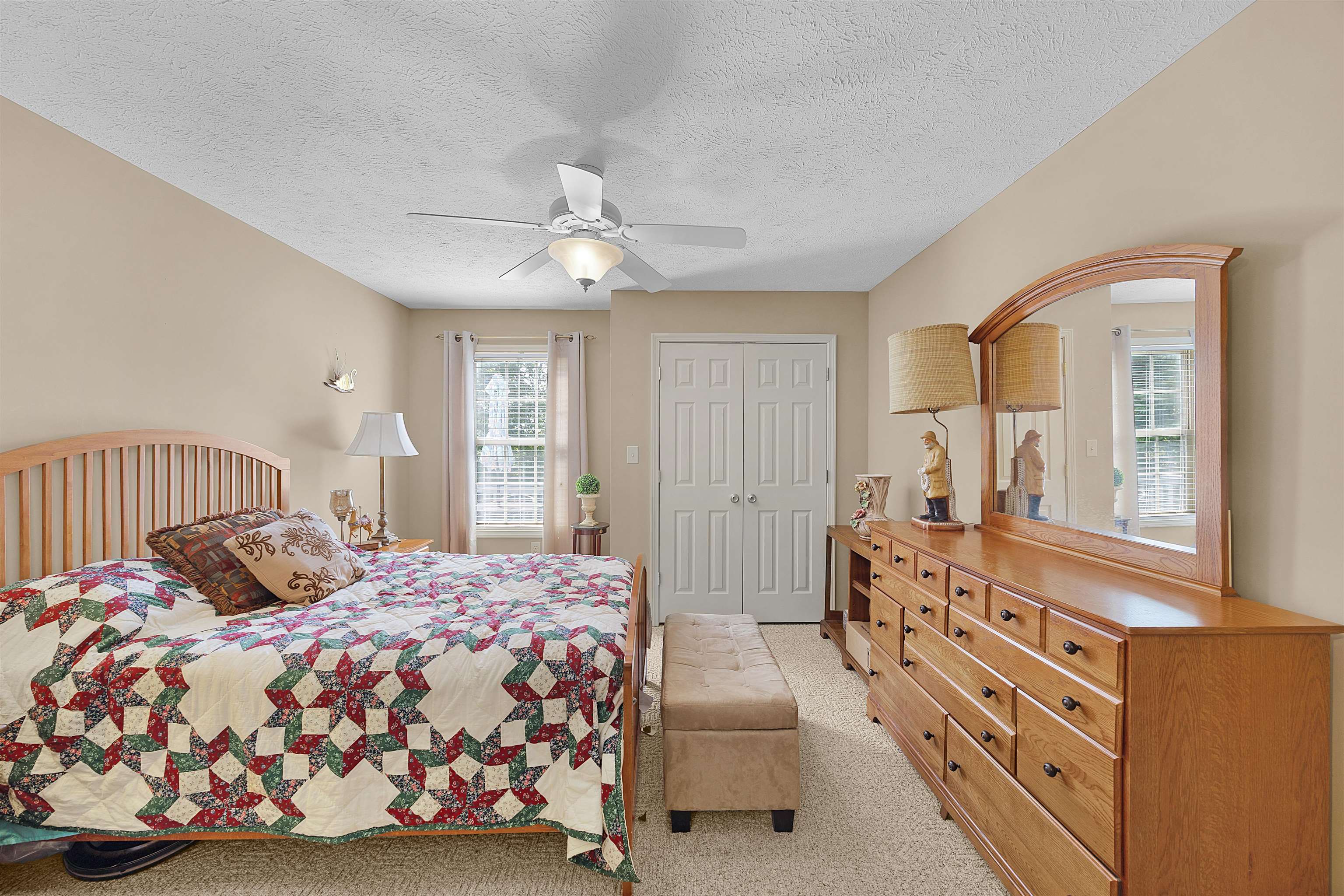 165 Ping Hl Cove Counce, TN 38326 - Photo 15 of 19 Bedroom featuring ceiling fan, light carpet, and a closet