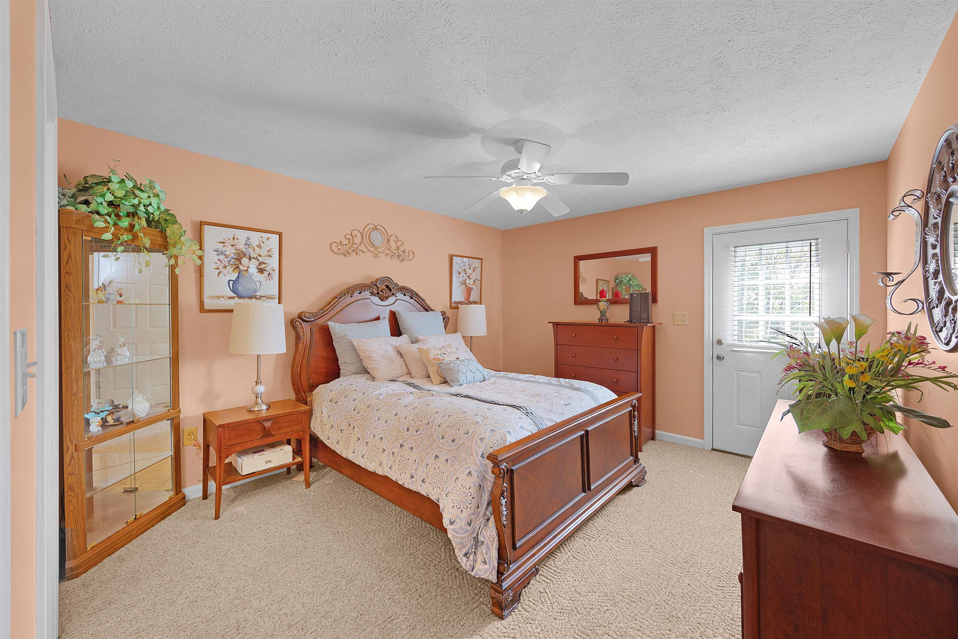 165 Ping Hl Cove Counce, TN 38326 - Photo 17 of 19 Bedroom featuring light colored carpet, a ceiling fan, baseboards, and a textured ceiling