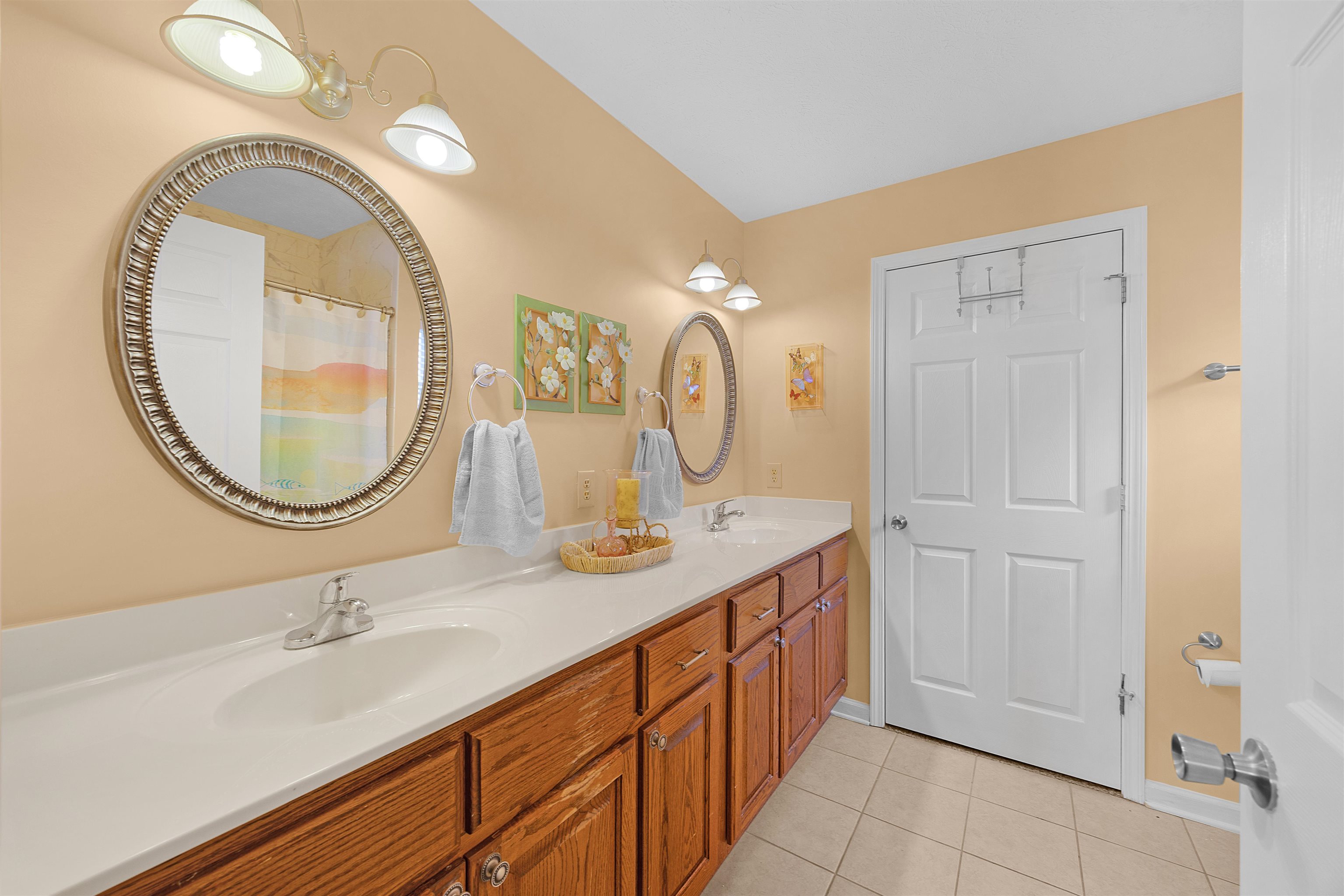 165 Ping Hl Cove Counce, TN 38326 - Photo 18 of 19 Bathroom with double vanity, a sink, baseboards, and tile patterned floors