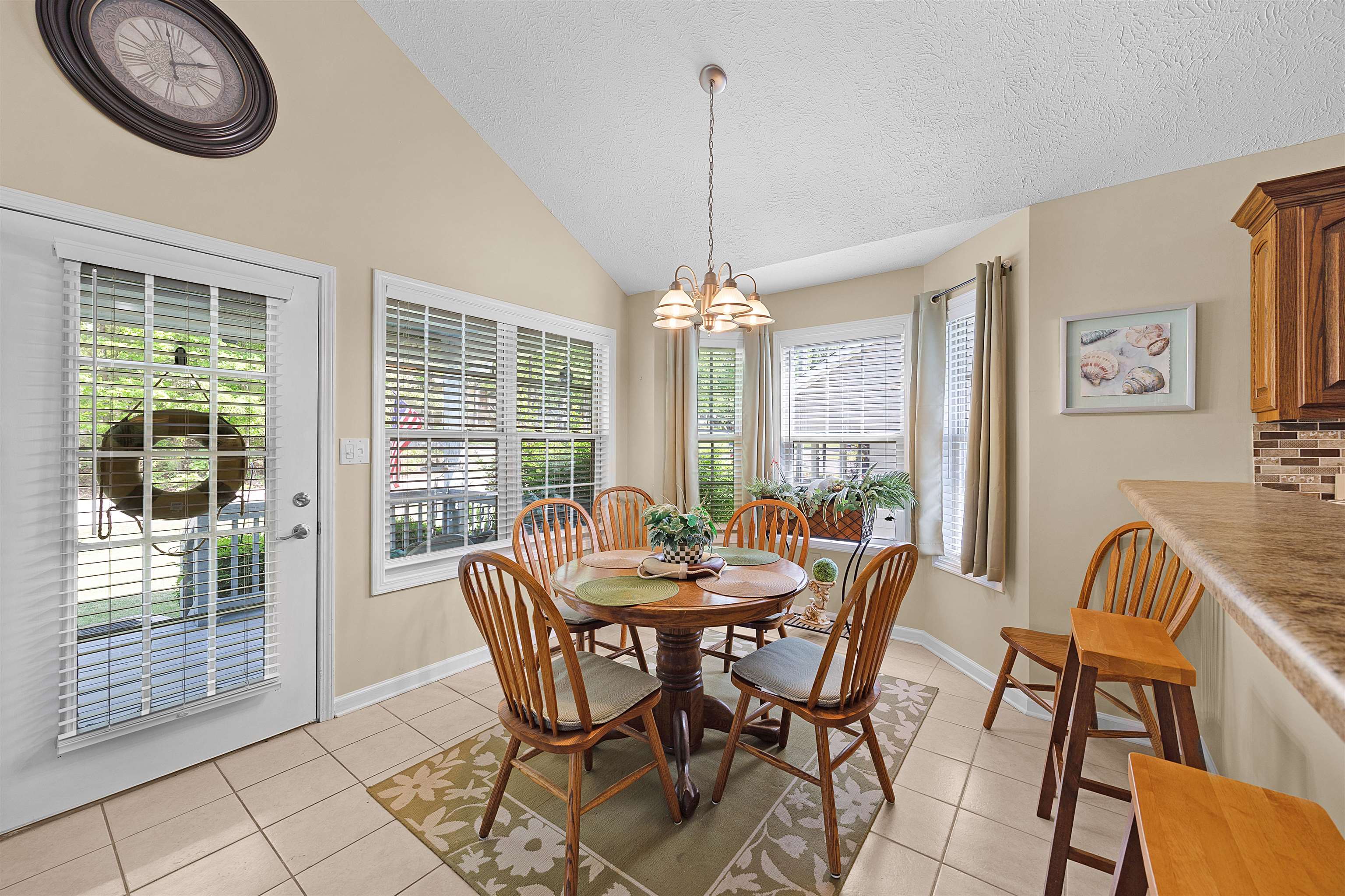 165 Ping Hl Cove Counce, TN 38326 - Photo 7 of 19 Dining room with an inviting chandelier, baseboards, light tile patterned flooring, and lofted ceiling