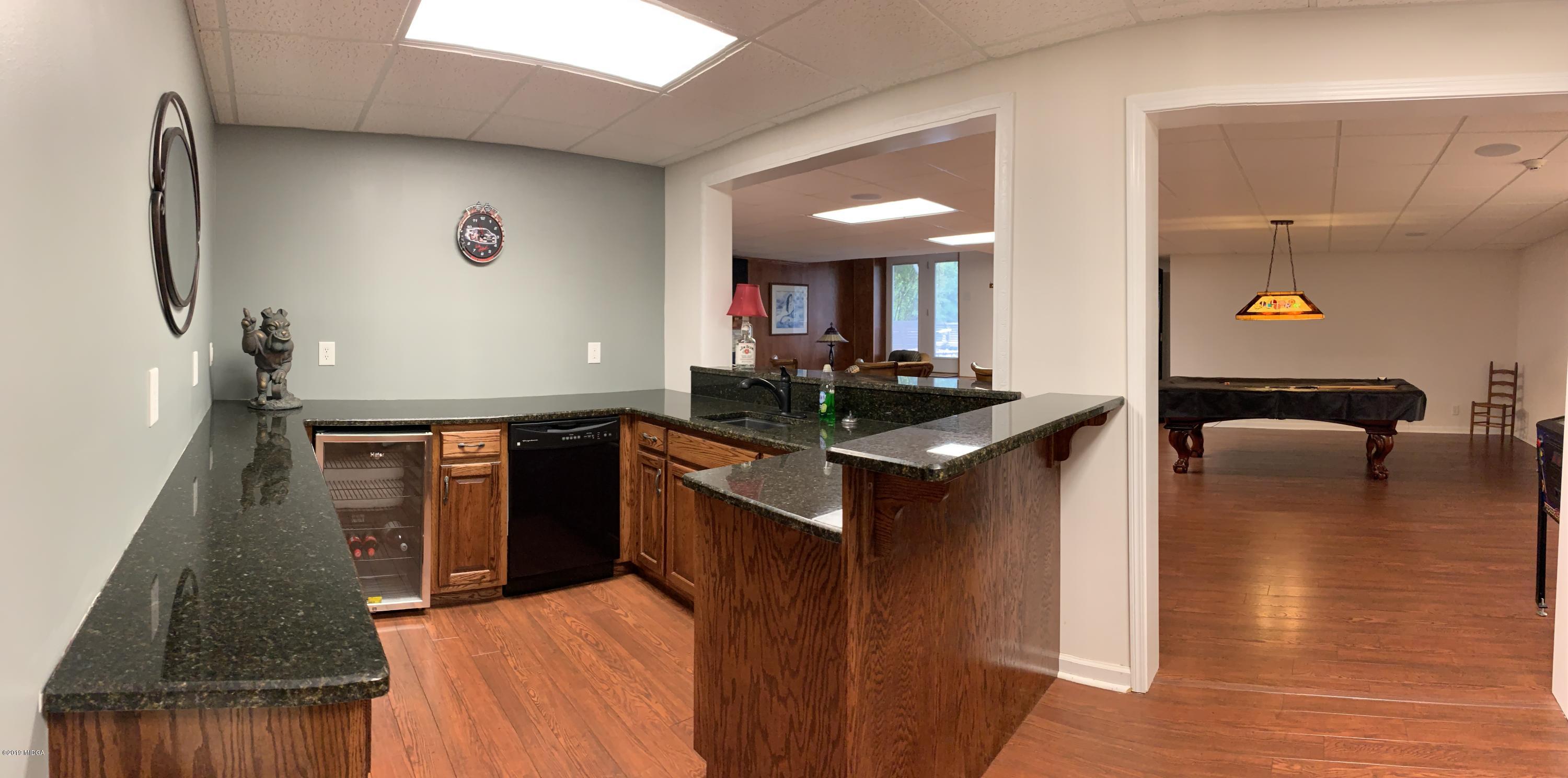 4540 Dixon Road Lizella, GA 31052 - Photo 40 of 59 a kitchen with a sink stove and refrigerator