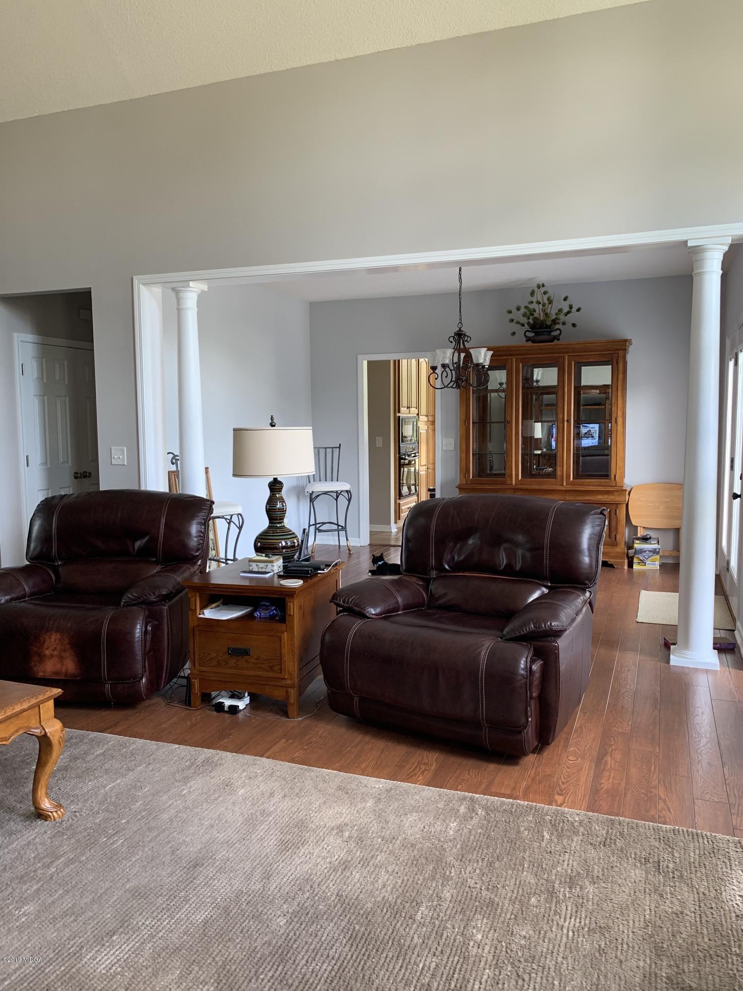 4540 Dixon Road Lizella, GA 31052 - Photo 8 of 59 a living room with furniture and wooden floor