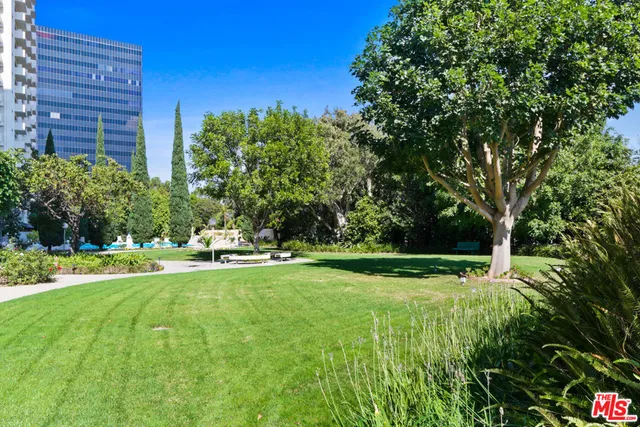 a view of a backyard with swimming pool