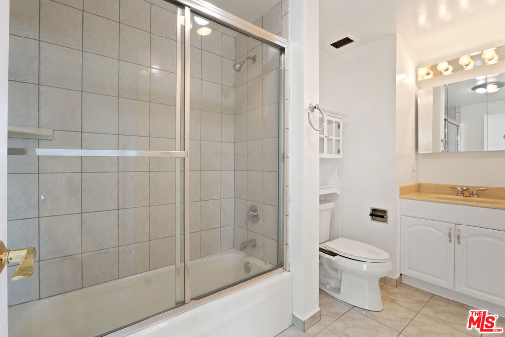 2160 Century Hill, Unit 605 Los Angeles, CA 90067 - Photo 6 of 18 a bathroom with a shower a toilet and sink