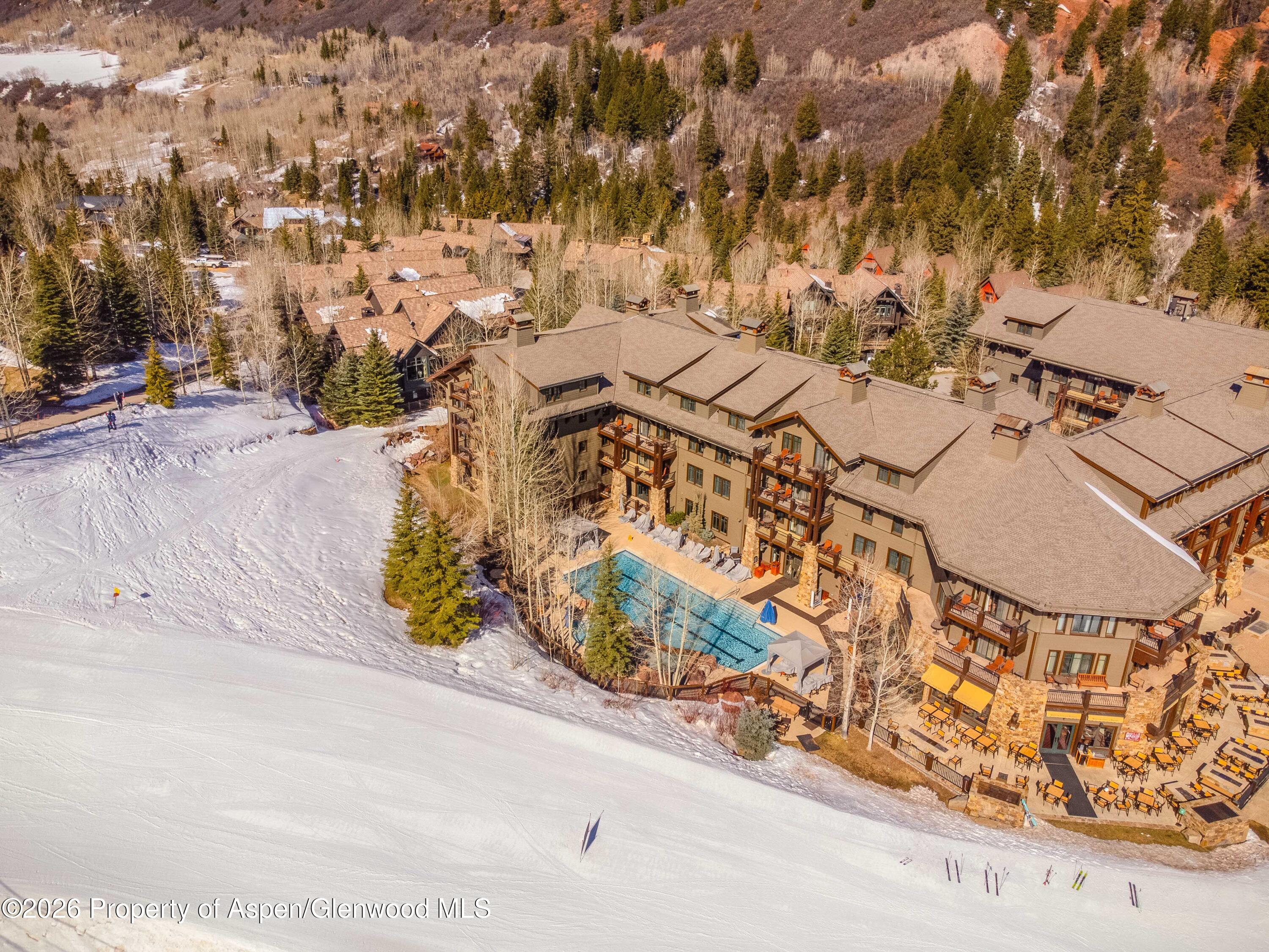 75 Prospector Road, Unit 82081 Aspen, CO 81611 - Photo 2 of 14 an aerial view of residential houses with outdoor space