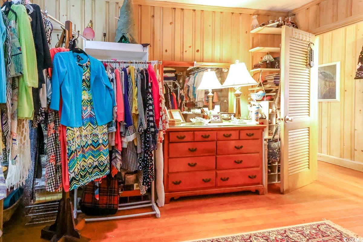 404 13th Avenue South Myrtle Beach, SC 29577 - Photo 14 of 38 Spacious closet with wood finished floors