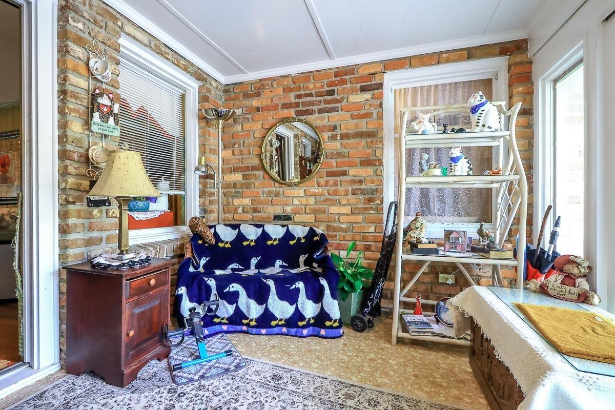 404 13th Avenue South Myrtle Beach, SC 29577 - Photo 25 of 38 Bedroom featuring brick wall and crown molding