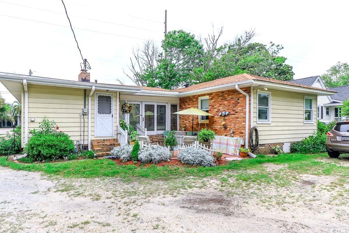 404 13th Avenue South Myrtle Beach, SC 29577 - Photo 26 of 38 Ranch-style house with entry steps, a chimney, and brick siding