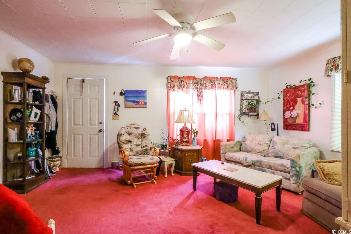 404 13th Avenue South Myrtle Beach, SC 29577 - Photo 29 of 38 Living area with carpet floors and a ceiling fan