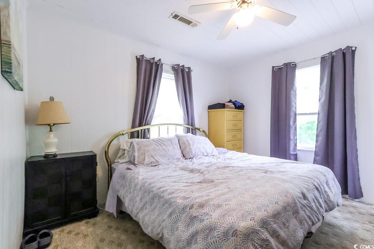 404 13th Avenue South Myrtle Beach, SC 29577 - Photo 32 of 38 Bedroom with carpet floors and a ceiling fan