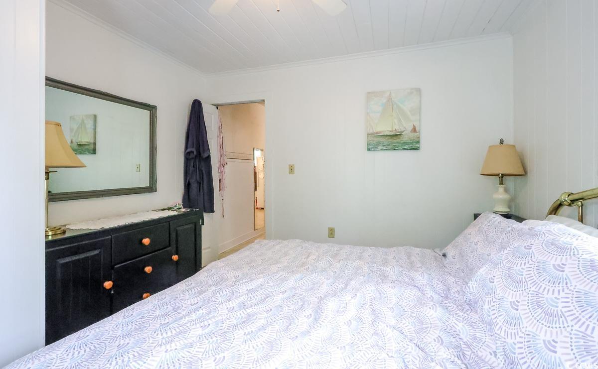 404 13th Avenue South Myrtle Beach, SC 29577 - Photo 33 of 38 Bedroom featuring crown molding and a ceiling fan