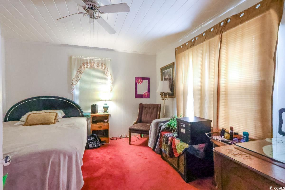 404 13th Avenue South Myrtle Beach, SC 29577 - Photo 37 of 38 Bedroom with carpet floors, multiple windows, and a ceiling fan