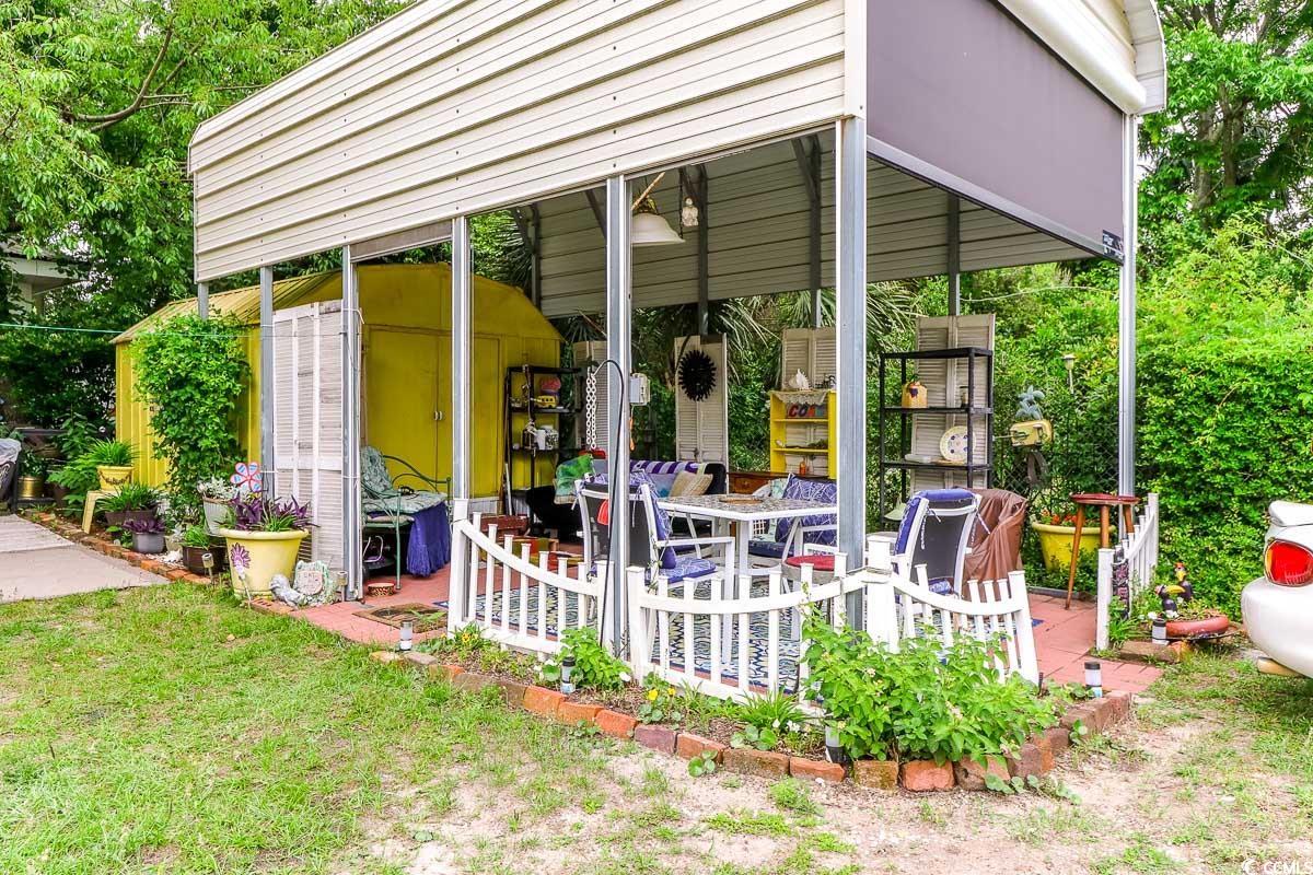 404 13th Avenue South Myrtle Beach, SC 29577 - Photo 38 of 38 View of patio with a shed