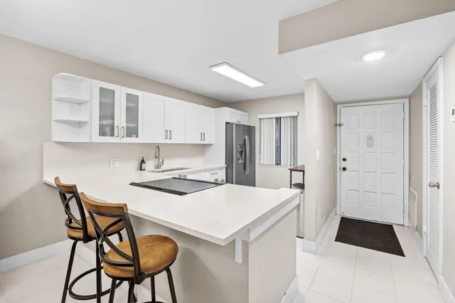 a kitchen that has a cabinets and a stove