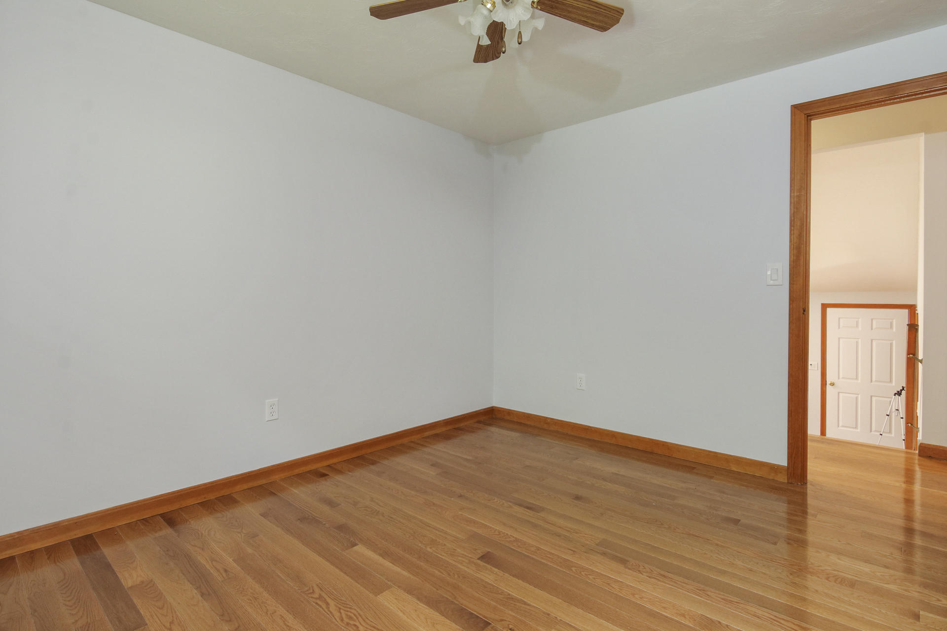 725 Old Stage Road Centerville, MA 02632 - Photo 20 of 53 a view of an empty room with wooden floor and a window